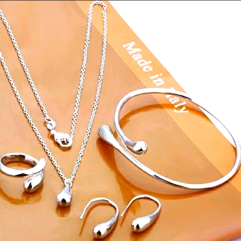 925 stamped silver Eardrop bracelet earrings.NWT